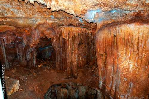 Crimea, Ukraine. Stalactites, stalagmites on the walls of the Emine-Bair-Khosar cave. Template for design. Selective sharpness.