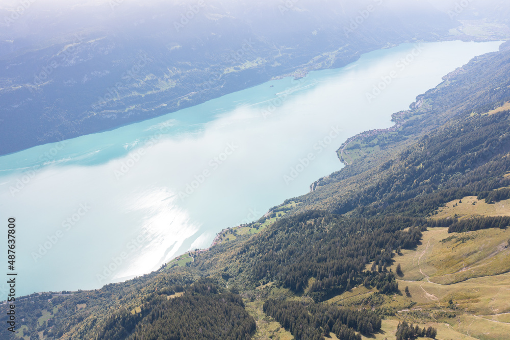 Amazing shot of a beautiful landscape in the alps of Switzerland. Wonderful flight with a drone over an amazing landscape in the canton of Bern. Epic view over a lake called Brienzersee.