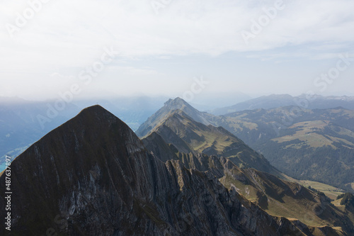 Amazing shot of a beautiful landscape in the alps of Switzerland. Wonderful flight with a drone over an amazing landscape in the canton of Bern. Epic view over a lake called Brienzersee.