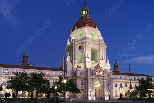 Beautiful image of the Pasadena City Hall in Los Angeles County shown against a deep blue sky at dusk. This building is listed in the national Register of Historic Places.