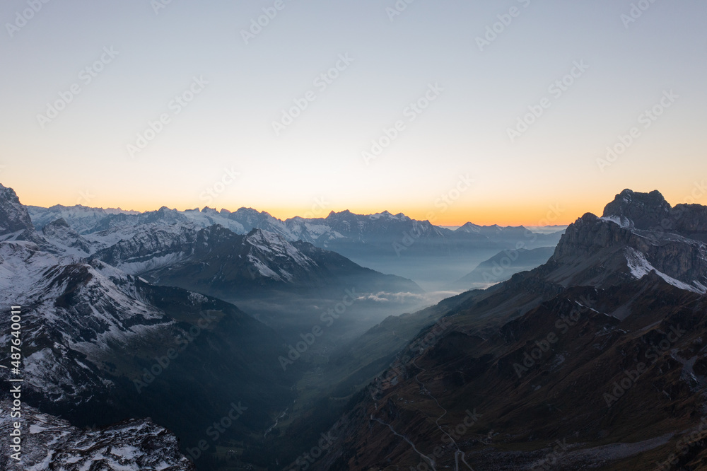 Amazing shot of a beautiful landscape in the alps of Switzerland. Wonderful flight with a drone over an amazing landscape in the canton of Glarus. Epic view at sunset.