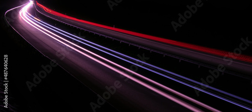 Night road lights. Lights of moving cars at night. long exposure red, blue, green, orange.