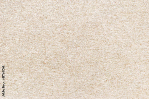 Beige craft paper texture, cardboard texture, a sheet of light recycled craft paper texture as background