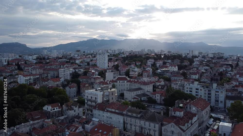 Split, Croatia - August 28, 2021: Drone sequence looking back, revealing the walled city and part of the port and promenade. Split, Croatia - August 28, 2021: Drone sequence looking back, revealing the walled city and part of the port and promenade.