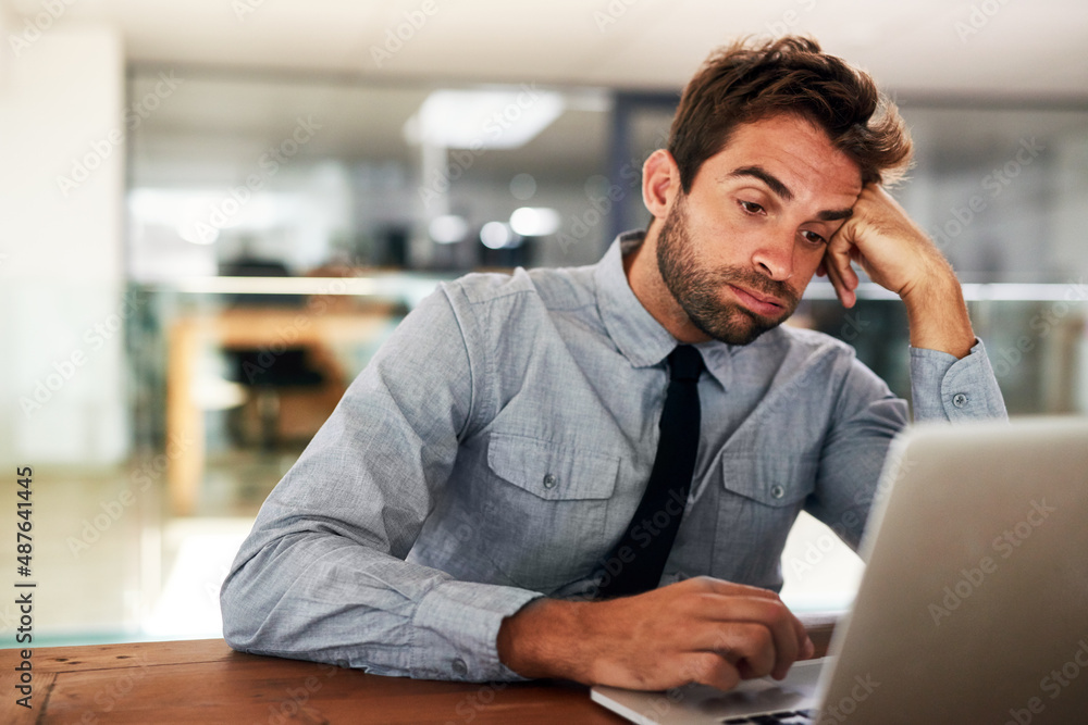 No one said success would be easy. Cropped shot of a handsome young businessman in his office. No one said success would be easy. Cropped shot of a handsome young businessman in his office.