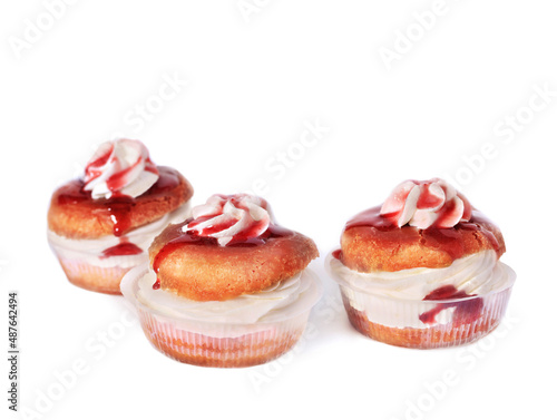 Savarines cakes with whipped cream. Rhum baba cake. 