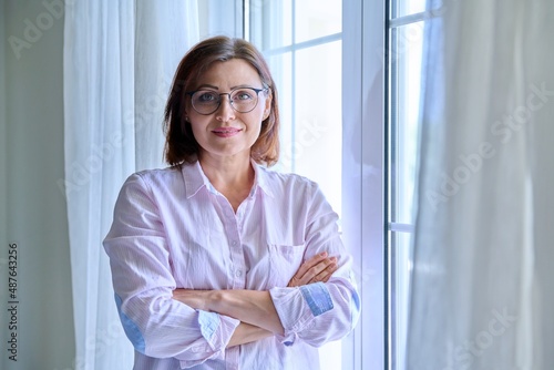 Free Download Portrait of a confident smiling mature woman looking at the camera. - GFXLoad