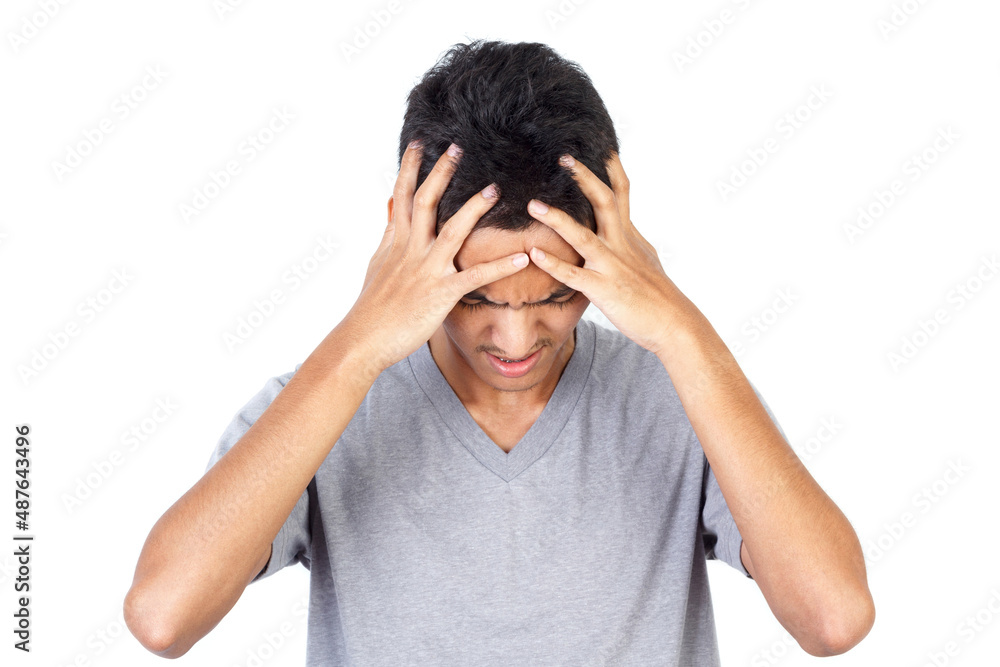 Young man wearing gray t-shirt suffering from headache isolated on white background. Young man suffering migraine pain. feeling stress