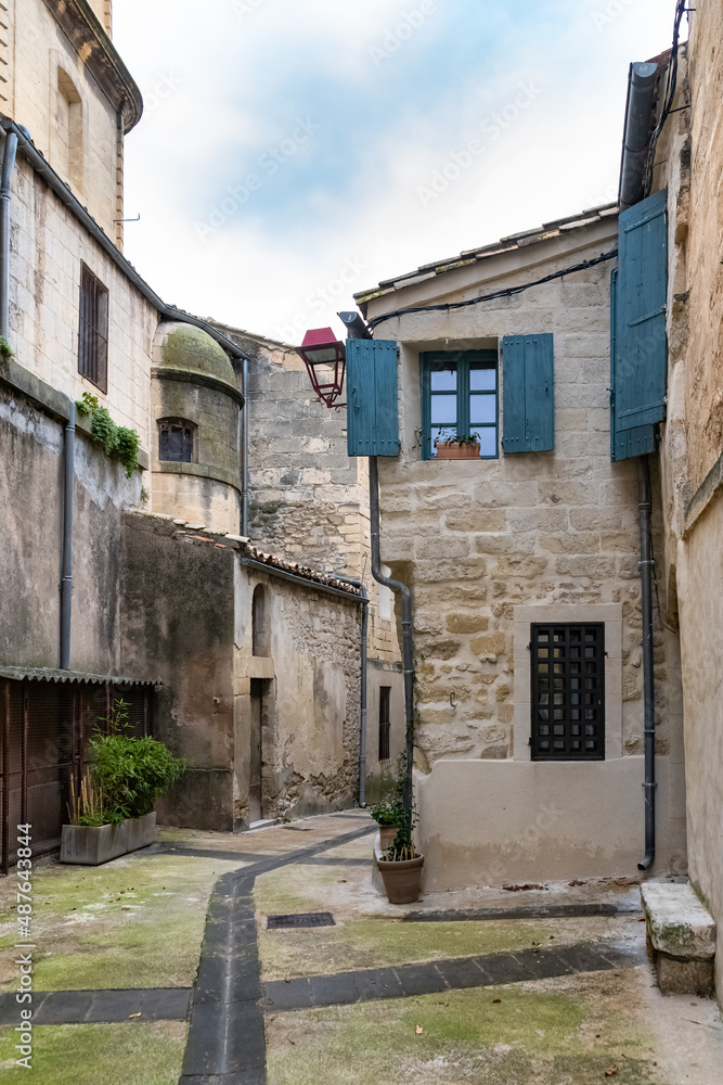 Sommieres, medieval village in France, view of typical street and houses
