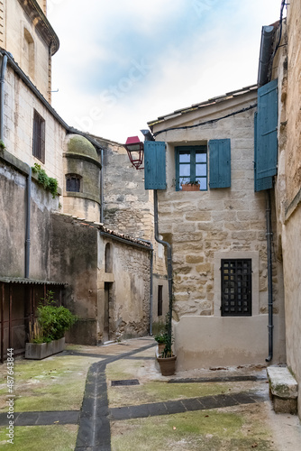 Sommieres, medieval village in France, view of typical street and houses 