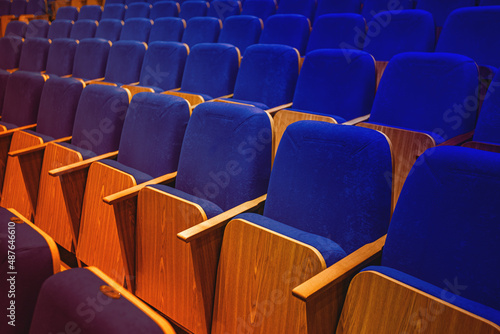 auditorium without people with blue chairs