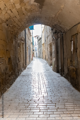 Sommieres  medieval village in France  view of typical street and houses 