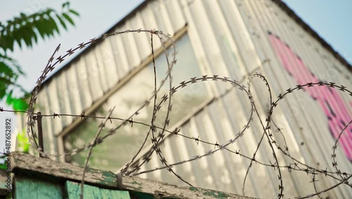 Barbed wire. Prison fence. View at the barb wall of the crime area or closed military camp. Security, Protection and Exclusion.