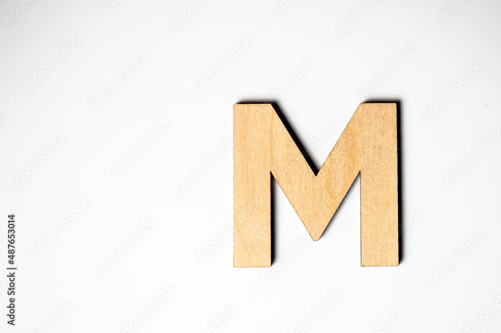 Wooden letter M on white background Wooden letter M on white background