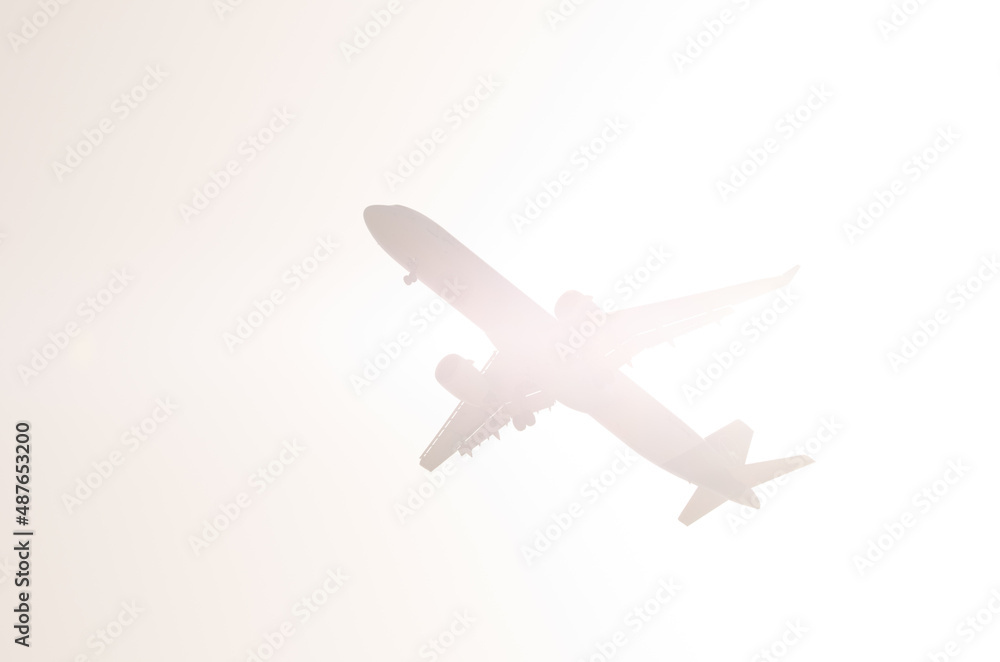 Airplane flying against the light. Aguimes. Gran Canaria. Canary Islands. Spain. Airplane flying against the light. Aguimes. Gran Canaria. Canary Islands. Spain.