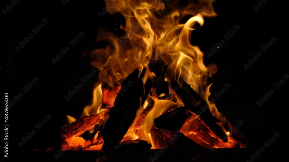 Realistic effect of isolated fire on a black background. The concept of particles, sparkles, flame and light, fire, heat, strength, elements. Light for carnival for jumping over the fire Realistic effect of isolated fire on a black background. The concept of particles, sparkles, flame and light, fire, heat, strength, elements. Light for carnival for jumping over the fire