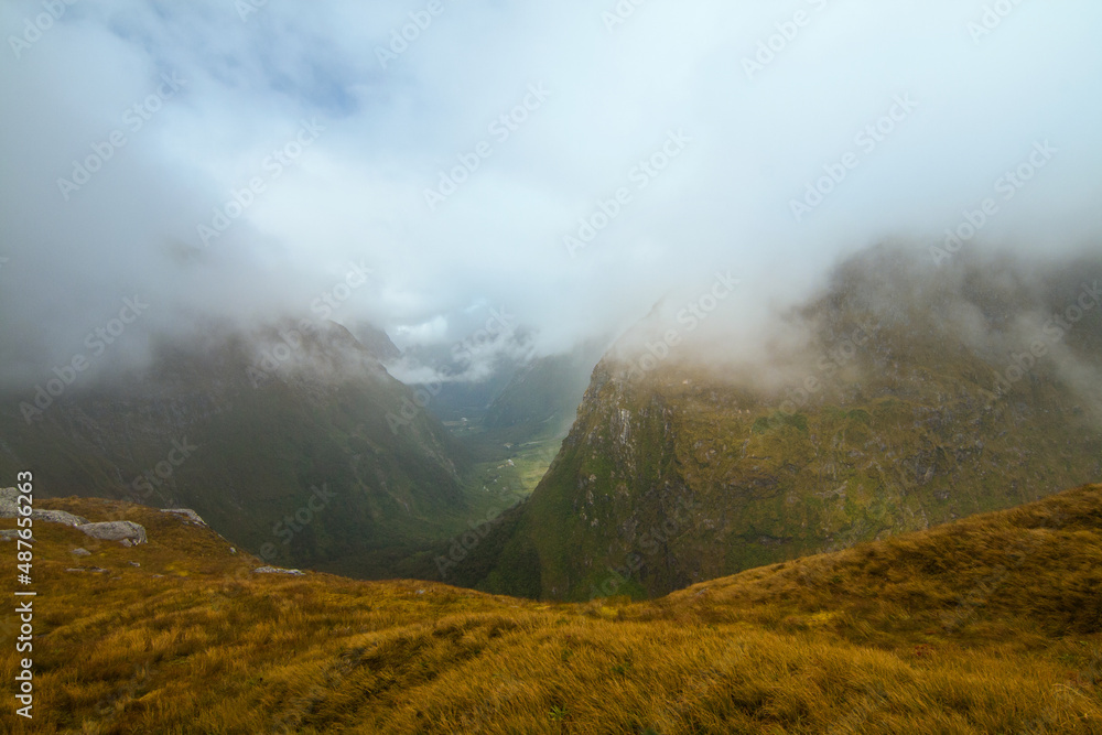 Misty landscape and fog covered mountains, New Zealand Milford track Fiordland