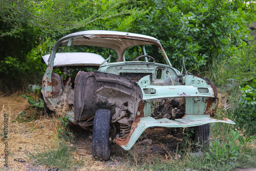 The body of an old rusty retro car without front wings, engine and doors © Dav_782