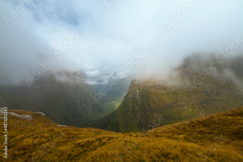 Misty landscape and fog covered mountains, New Zealand Milford track Fiordland
