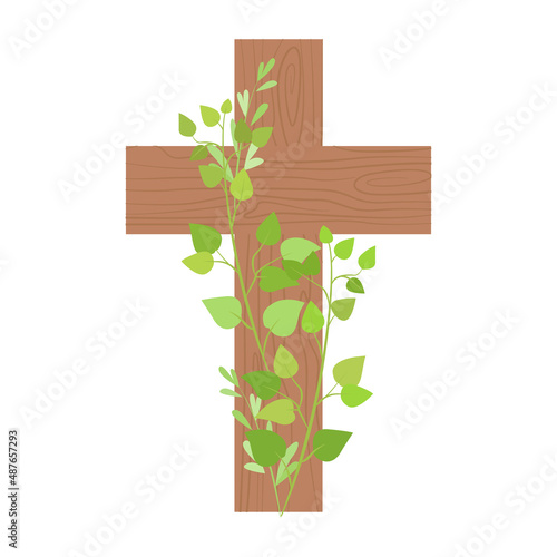 Wooden cross decorated with green branches. Easter