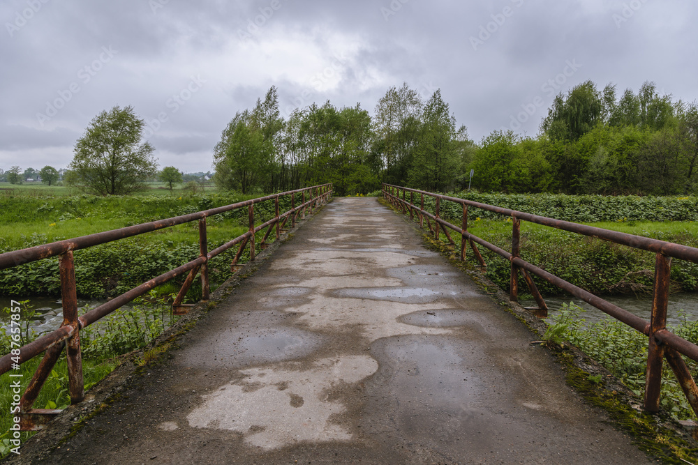 Obraz na płótnie Old bridge over River Wapiennica rivulet in Czechowice-Dziedzice town, Silesia region of Poland w sypialni