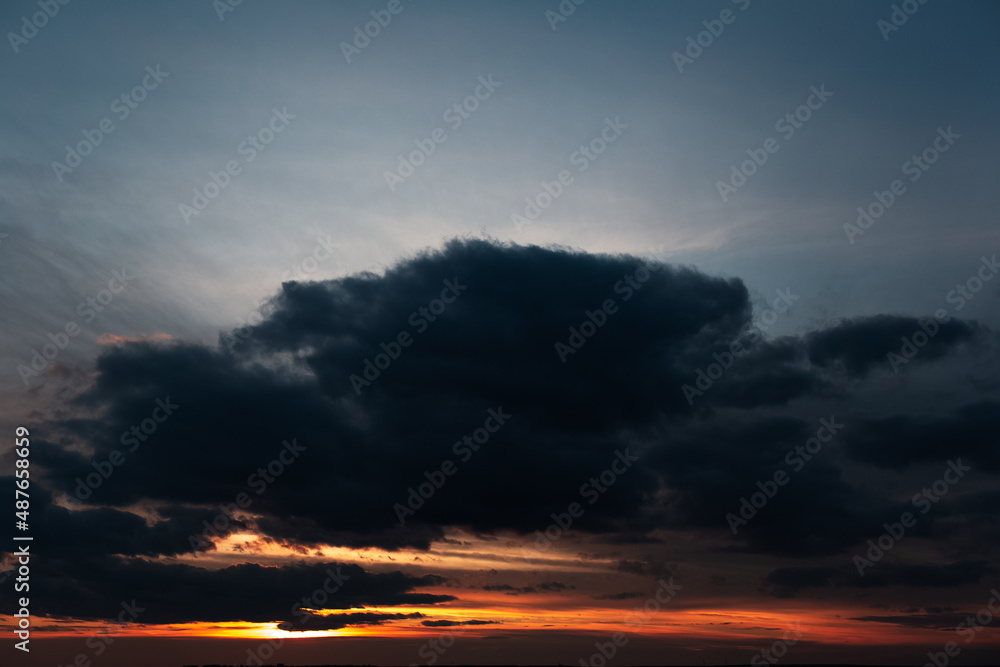 Landscape of beautiful sunrise and stormy clouds.