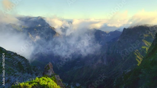foggy Madeira mountain landscape, aerial view of volcanic mountain peak, Portuguese travel destination, hiking on Madeira island photo