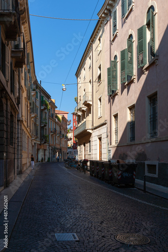 Cobblestone street with buildings  Verona  Italy