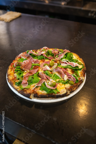 raw ham pizza and rucula