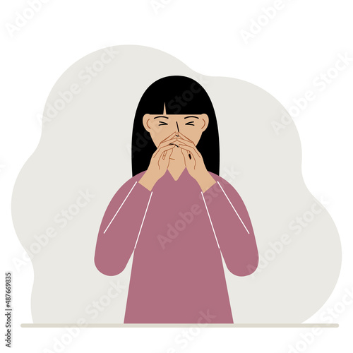 The woman covers his nose with his hands. The concept of a sick person, sneezes, seasonal allergies, bad smell.