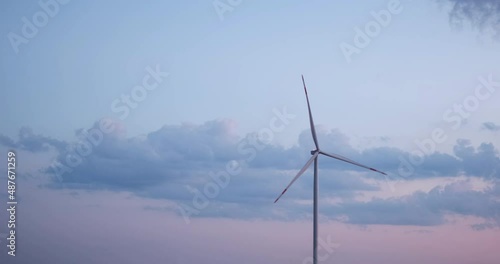 Wallpaper Mural Cinematic windmill generation green energy in a neutral field with a beautiful cloudy sunset and gradient sky. Sustainable alternative power source, mill farm. Climate change, ecology tech environment Torontodigital.ca