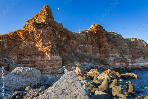 Rocks seen from Bolata Beach, located in Kaliakra Nature Reserve over Black Sea in Bulgaria photo