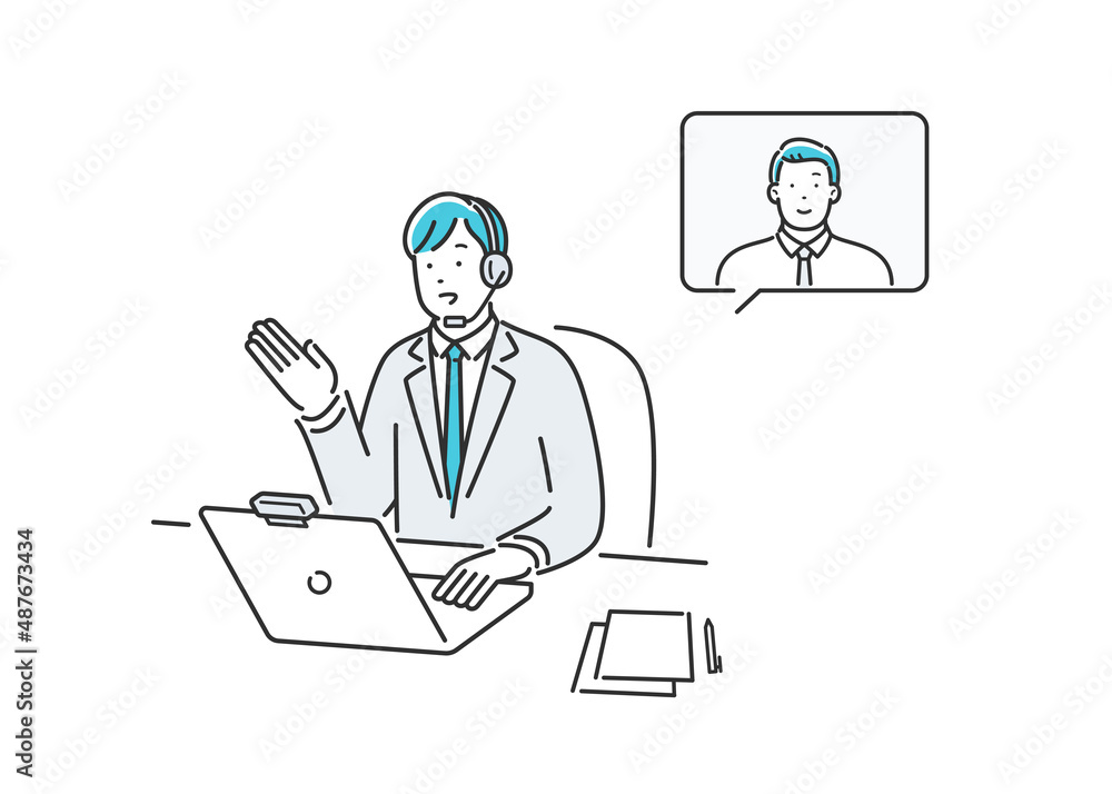ネットで通話する会社員の男性 ネットで通話する会社員の男性
