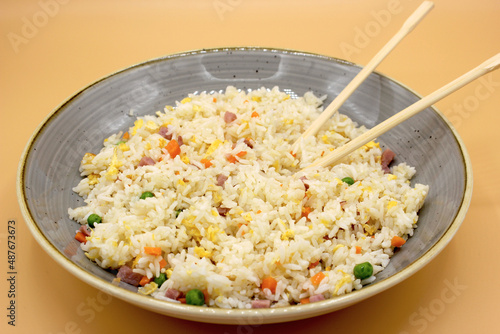 Chinese rice 3 delicacies with chopsticks