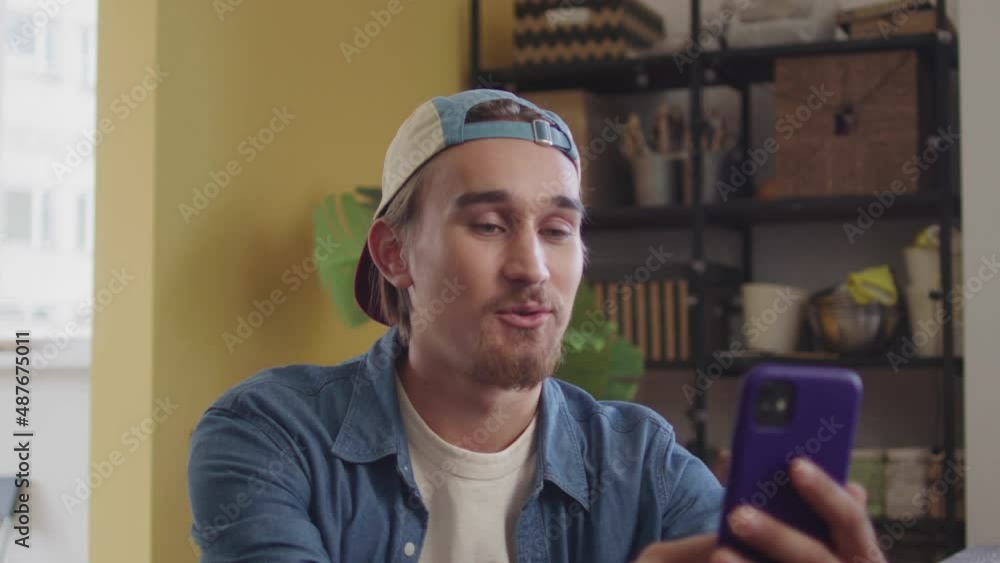 A handsome man is talking with his friend on the phone A handsome man is talking with his friend on the phone