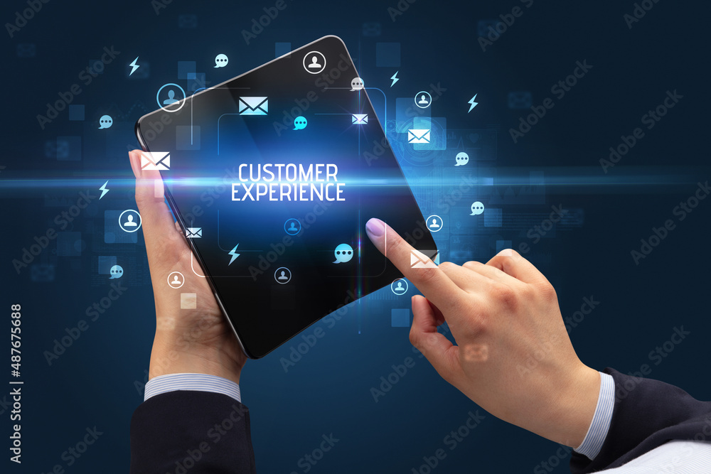 Businessman holding a foldable smartphone, social media concept Businessman holding a foldable smartphone, social media concept