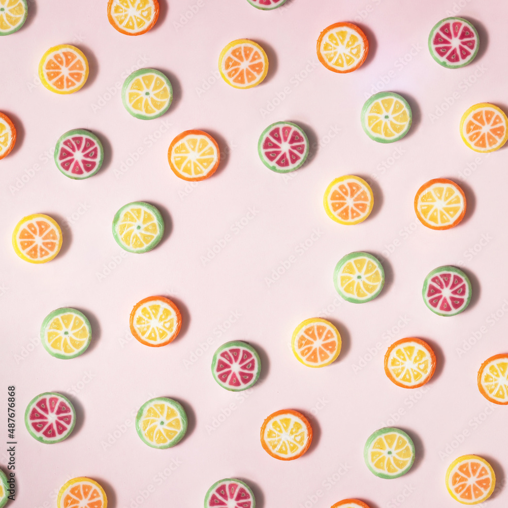 Circle copy space made from fruit candies on pastel light pink background. Creative sweets pattern composition. Minimal fruit and sugar concept. Circle copy space made from fruit candies on pastel light pink background. Creative sweets pattern composition. Minimal fruit and sugar concept.