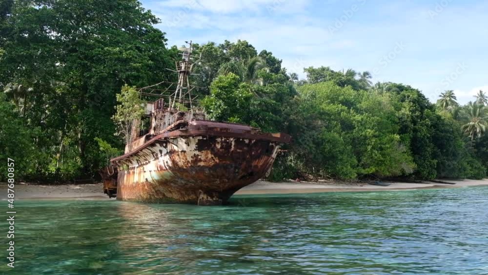 Old rusty shipwreck on once popular island resort destination Arovo Island, abandoned, in Autonomous Region of Bougainville, Papua New Guinea Old rusty shipwreck on once popular island resort destination Arovo Island, abandoned, in Autonomous Region of Bougainville, Papua New Guinea