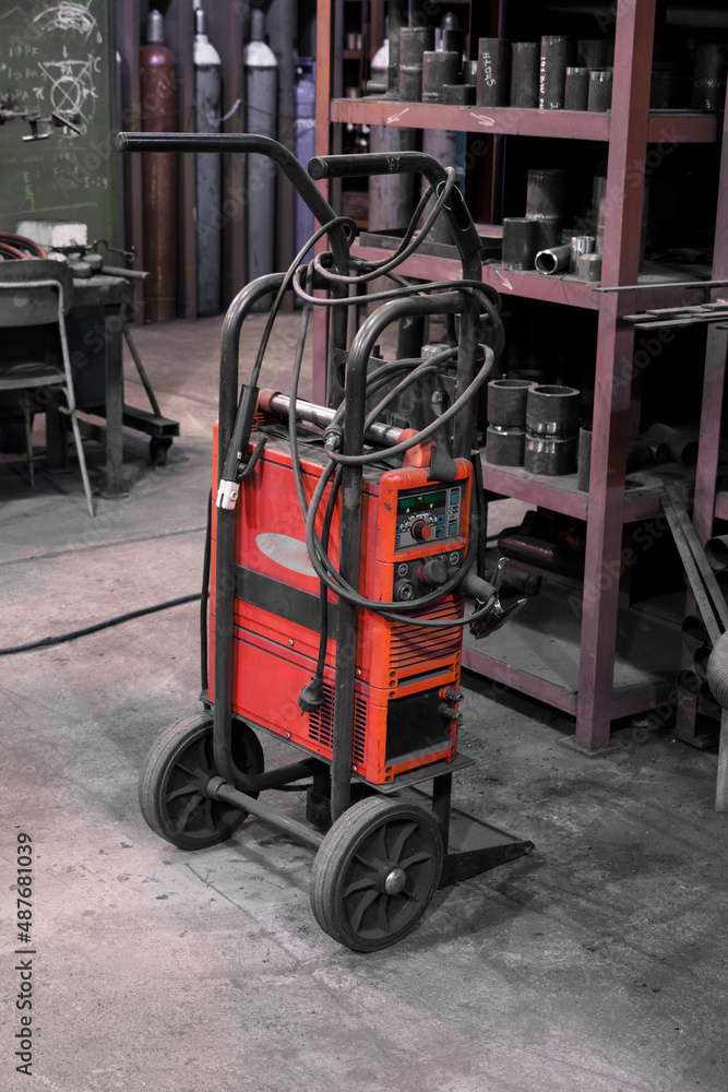 Mobile water-cooled welding set in the workshop. Mobile water-cooled welding set in the workshop.