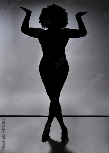 Silhouette of a black woman with white background