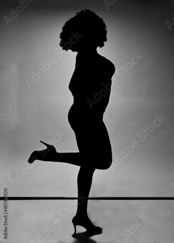 Silhouette of a black woman with white background
