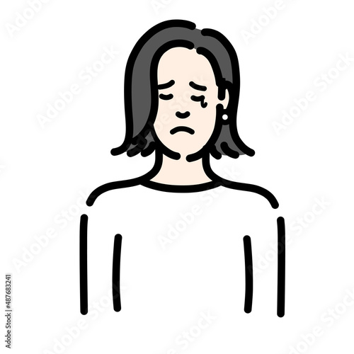 悲しそうに涙を流している若い女性
