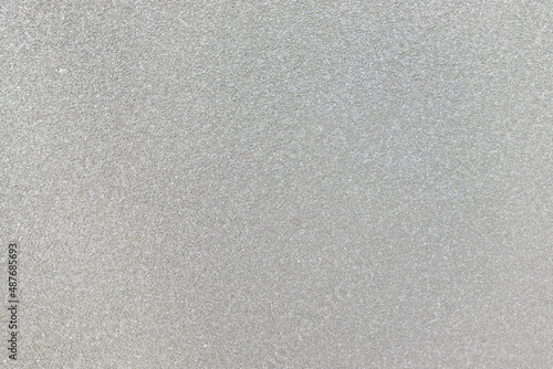 うすい灰色の壁のざらざらした質感