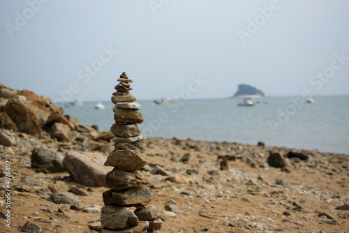 Stone pagoda is piled up on the beach.