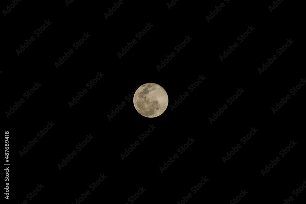 Full moon over a completely dark sky Full moon over a completely dark sky
