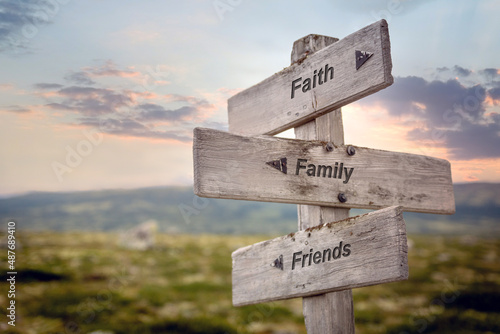 Canvas Print faith family friends text quote on wooden signpost outdoors in nature during sunset