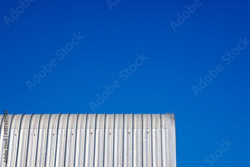 Metal sheet roof and blue sky on sunny day , can be used as a background