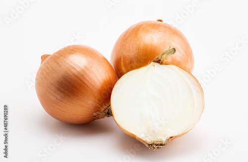 Pile of fresh onion and sliced on white background