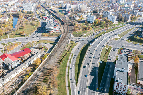 highway intersection of a city. aerial overhead view of urban roads and railway.