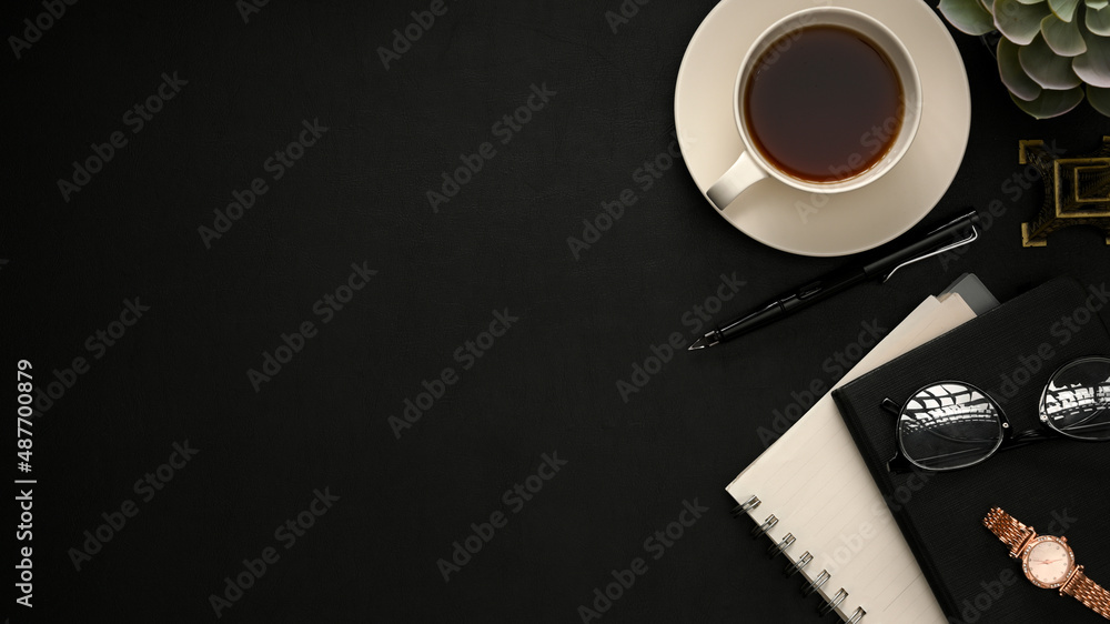 Minimal black workspace background with accessories and copy space ...